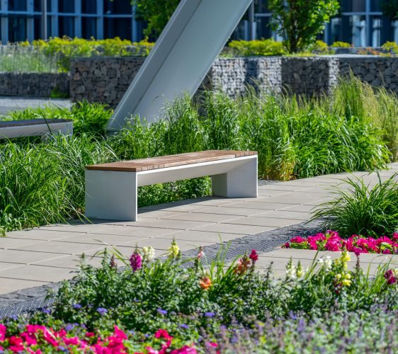 Empty,Concrete,Bench,With,Wooden,Slats,For,Sitting,On,Tile